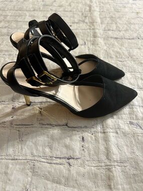 BLACK GOLD TONE STILETTO HEELS GOLD WING EMBLEM ON SOLE POINTY TOE ANKLE STRAPS